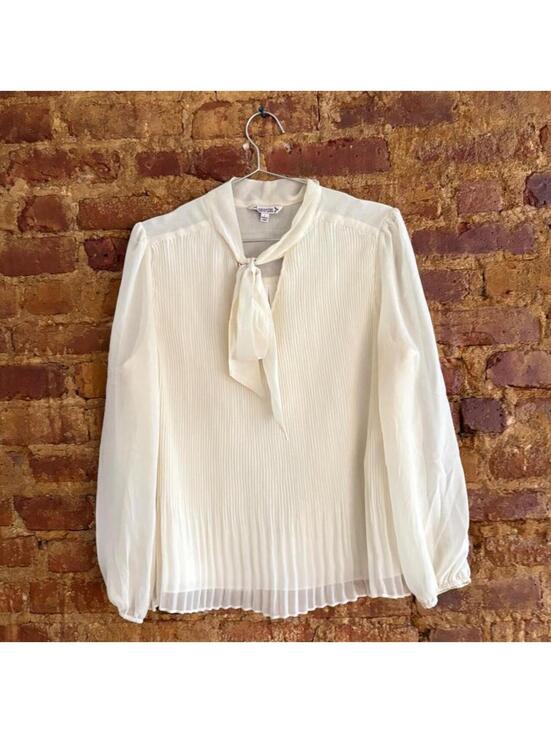 Nanette Lepore Tops - Nanette Lepore cream blouse with tie front detail and pleated texture